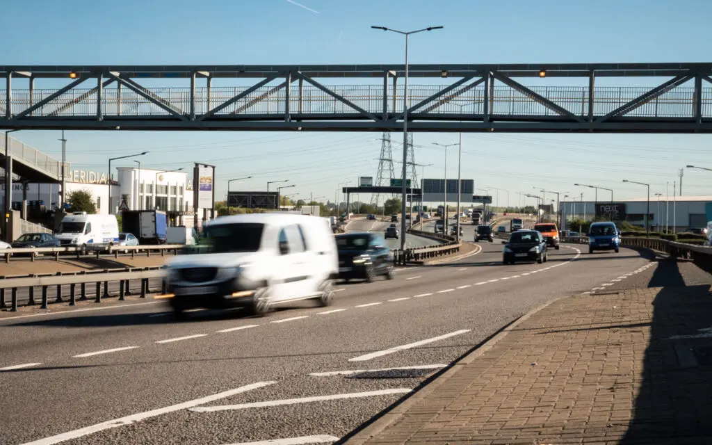 The A406 North Circular road, London. Traffic passing through the Edmonton industrial estates.